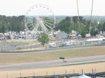 Panoramic view over entrance to last corner (fun fair in background)