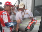 Nicky signs our customer's photo
